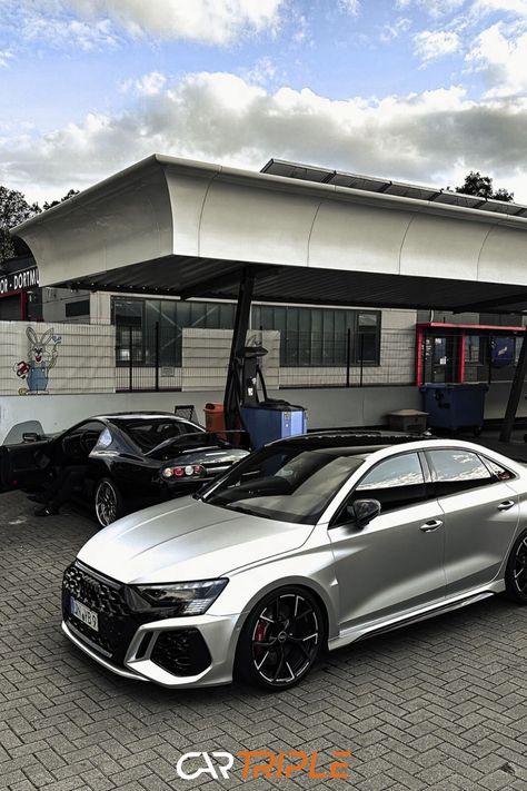 Audi RS3 parked in front of a building with a black sports car in the background. Audi A3 Sedan, Dream Whip, Audi Rs3, Audi Sport, Audi Rs, Audi Cars, Dream Garage, Audi Tt, My Dream Car