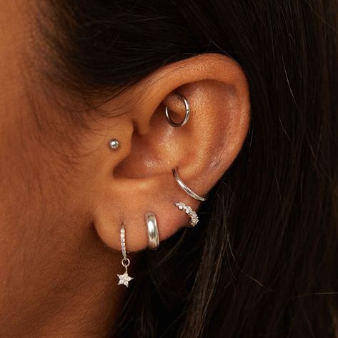 Description Our essential for everyday - say hello to the Basic Ear Cuff in Silver. No piercing needed, the cuff will sit comfortably in your ear for that “oh I just got it pierced” faux conch piercing look (we won’t tell). You can also stack it up with different plating’s and styles for a curated vibe. Details    Composition Rhodium Plated Sterling Silver Hoop Size 1.2cm (adjustable)   Care As most of our pieces are costume jewellery made from sterling silver or brass, plated wit Conch Hoop, Ear Stack, Silver Ear Cuff, Conch Piercing, And Just Like That, For Sale Sign, Sterling Silver Hoops, Simple Earrings, Ear Jewelry