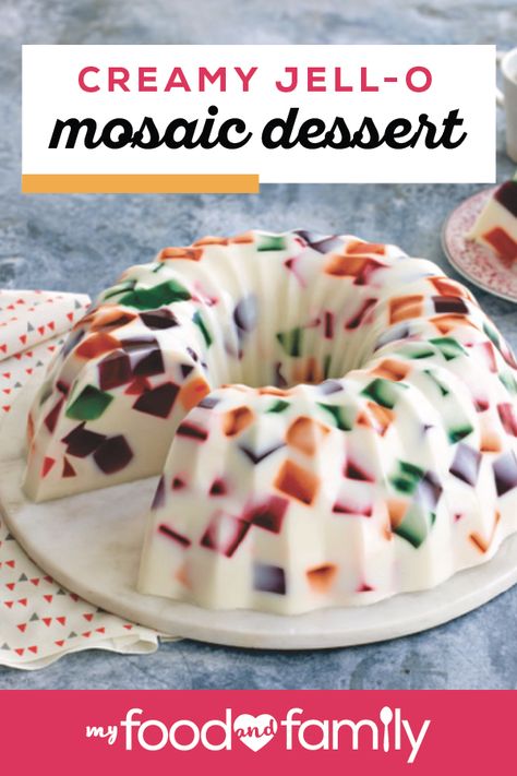 Creamy JELL-O Mosaic Dessert – Packed full of fun colors and sweet flavors, this no-bake recipe looks beautiful on your dessert table and tastes great, too. Just combine different JELL-O flavors like cherry, lime, orange, and grape to create this show-stopping treat. Mosaic Jelly Recipe, Mexican Jello Desserts, Mosaic Jello Recipe, Mosaic Gelatin, Creamy Jello, Jelly Desert, Glass Jello, Jello Deserts, Hasty Pudding