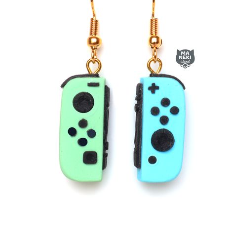 How cute are these handmade Animal Crossing Nintendo Switch Earrings! Handmade with the best quality materials. Each dangle hangs from gold toned posts. Hand sculpted from high quality polymer clay, varnished with a matte sealant for long wear and protectant. These earrings would make a great gift to any Nintendo Switch gamer Details: Each Joycon Controller size : 3/4 of an inch 1 1/4 inch from top to bottom Gold Toned (nickel free) Hypoallergenic posts for sensitive ears!! Boxed in our signatur Clay Nintendo Switch, Clay Nintendo, Mario Clay, Mario Switch, Fimo Kawaii, Lesbian Earrings, Weird Jewelry, Quirky Earrings, Polymer Clay Jewelry Diy