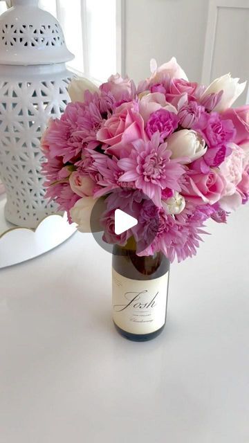 Flower On Wine Bottle, Mother’s Day Floral Arrangements Diy, Wine Bottle Flower Arrangements, Wine With Flowers, Wine Bottle Flowers, Ideas For Mothers Day, Wine Games, Wine Bottle Centerpieces, Diy Floral Decor