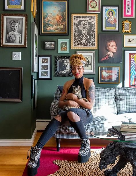 Maximalist designer Carmen René Smith chose a deep green wall color as the anchor for this eclectic gallery wall in a San Fransisco home. Instead of overpowering the space, the bold choice grounds the room with warmth and elegance. | Photographer: Meghan Caudill | Designer: Carmen René Smith, Aquilo Interiors Maximalist Gallery Wall, Green Wall Color, Herringbone Wall, Graphic Pillow, Dark Green Walls, Eclectic Gallery Wall, Green Sofa, Dark Walls, Green Cabinets