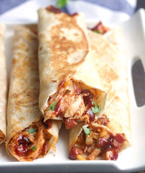 These Crispy BBQ Chicken & Bacon Wraps and simple, delicious and so quick to make.  Filled with chicken, cheese, bacon and BBQ sauce . . .a perfect weeknight meal. Crispy Bbq Chicken, Bacon Wraps, Bbq Chicken Wraps, Bacon Wrapped Chicken, Pudding Desserts, Chicken Wraps, Idee Pasto Sano, Chicken Bacon, Wrap Recipes