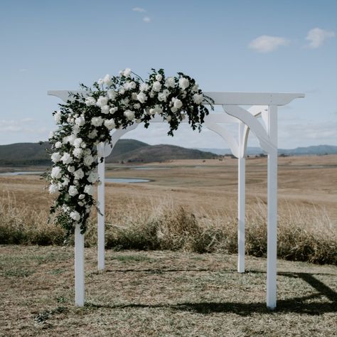 A stunning timeless wedding ceremony featuring rose dense bridal arbour and lush greenery. Paddocks endless as the eyes can see. White Wedding Arbor, Wedding Arbour Flowers, White Arbour, Paddock Wedding, Timeless Wedding Ceremony, Green Ceremony, Wedding Flowers Ceremony, White And Greenery Wedding, Flowers 2023