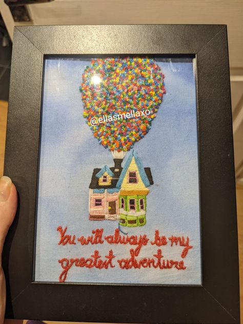 This is an embroidery of the house in Disney Pixar - Up. The house is pink on the left, green on the bottom right and then yellow on the top right. There is a nice blue used to look like panels around the roof, and the roof is black. There is some embroidered text at the bottom that reads "You will always be my greatest adventure" which is a quote from the film.
The top half of the photo consists of a large amount of different coloured french knots that are supposed to look like balloons. Disney Up Movie, Pixar Up House, House Embroidery, Up Disney, Up Movie, Disney Pixar Up, Disney Up, Crafty Creations, Up House