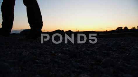 View Of Man's Legs While Walking On Stone Beach, Slow Motion. Silhouette Video Effects, Free Footage, Walk On, Stock Footage, Stock Video, Motion, Walking, Stone