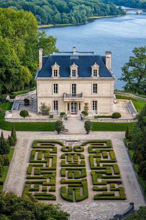 High angle view of a modern french mansion with dark blue roof ornate facade front garden with chrub maze marble pathways big river in the. Let’s reveal the charming features, quirky details, and luxurious elegance of French mansions. Modern French Mansion, House Inspo Exterior, Old Money Mansion, Aesthetic House Exterior, Tom Buchanan, New England Mansion, French Mansion, French Country Exterior, Driver Shoes