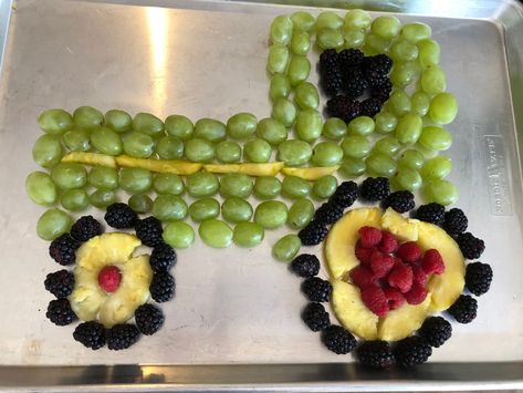 Tractor fruit tray for a farm themed birthday party. Made of green grapes, pineapple, blackberries, and raspberries. Fruit Tractor Party Ideas, Tractor Birthday Party Snacks, Tractor Fruit Tray, Farm Theme Fruit Tray, Tractor Theme Party Food, Cow Fruit Tray, Tractor Birthday Party Theme Food Ideas, Farm Fruit Tray, 10 Am Birthday Party Food