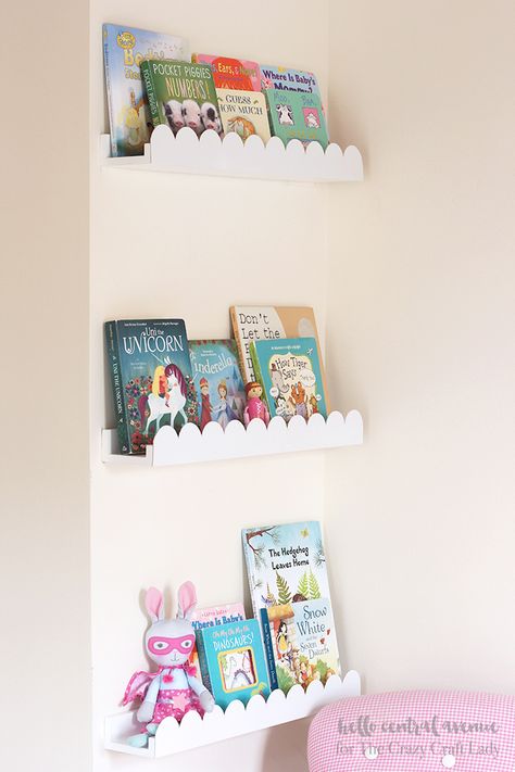 Add some scalloped trim to your boring book ledges to give them a fresh new upgrade!  The scalloped book ledges will give your space a fun and whimsical feeling! #shelfie #bookledges #bookshelves #TheCrazyCraftLady Scalloped Shelf Nursery, Scallop Book Ledge, Scalloped Book Ledge, Scallop Shelves Nursery, Book Shelf Ideas For Nursery, Girl Bedroom Shelves, Children Book Shelf, Diy Scalloped Bookshelf, Scalloped Wall Shelf