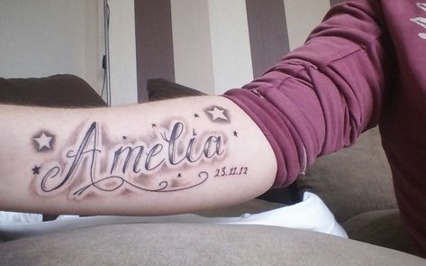 Amelia daughter's name on arm tattoo Tattoos For Childrens Names, Daughters Name Tattoo, Name Tattoos On Arm, Name Tattoos For Moms, Name Tattoos On Wrist, Baby Name Tattoos, Kid Name Tattoo, Tattoo On Arm