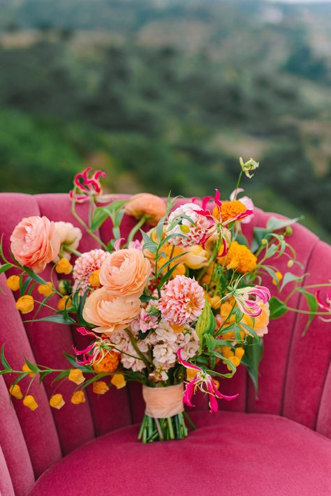 Bright Colors + Ocean-Inspired Details for This Funky Ranch Wedding in Santa Barbara Pink And Orange Flowers Wedding, Sunset Wedding Flowers, Poppy Wedding Cake, Orange Bouquet Wedding, Pink Orange Yellow Wedding, Desert Wedding Flowers, Pink And Orange Wedding Flowers, Pink And Orange Bouquet, Pink Orange Wedding Flowers