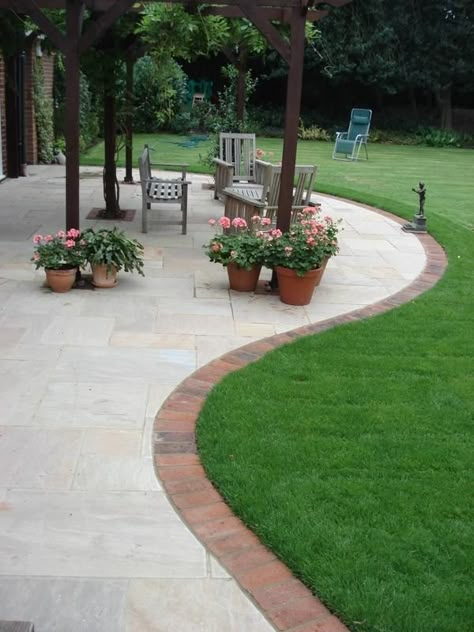 Patio With Edging, Stamped Concrete Patio Red Brick House, Brick Lined Patio, Small Garden Patio Ideas Paving, Red Brick House Patio Ideas, Red Brick House Patio, Patio Paving Ideas On A Budget, Indian Sandstone Patio Ideas, Brick Patio Ideas On A Budget