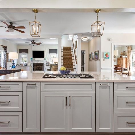 Cabinets- Double stack cabinets in 410F Linen by Waypoint Living Space with a 410F Painted Stone Island

Countertops- Diamond White Quartzite

Features: Cooktop in island, built in bench seat, double oven, warm accents

#greycabinets #kitchenisland #stackedcabinets #waypoint #whitecabinets
#greyisland #cooktop #faucet #benchseat Large Island With Cooktop And Seating, Islands With Stove Tops, Large Kitchen Island With Cooktop, Kitchen Island With Cooktop And Seating, Kitchen Island Stovetop, Stove In Island Kitchen, Kitchen Island Cooktop, Cooktop In Island, Stove In Island