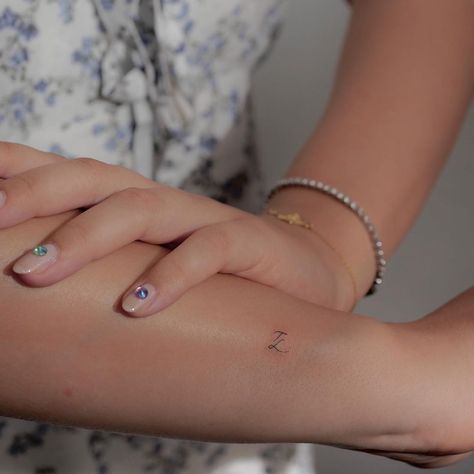 Sibling Tattoos Initials, Tiny Outer Wrist Tattoo, Pet Initial Tattoo, Sibling Initial Tattoo, Dog Initial Tattoo, Kids Initials Tattoos For Women, Hidden Initial Tattoo, Tiny Initial Tattoo, Dainty Initial Tattoo