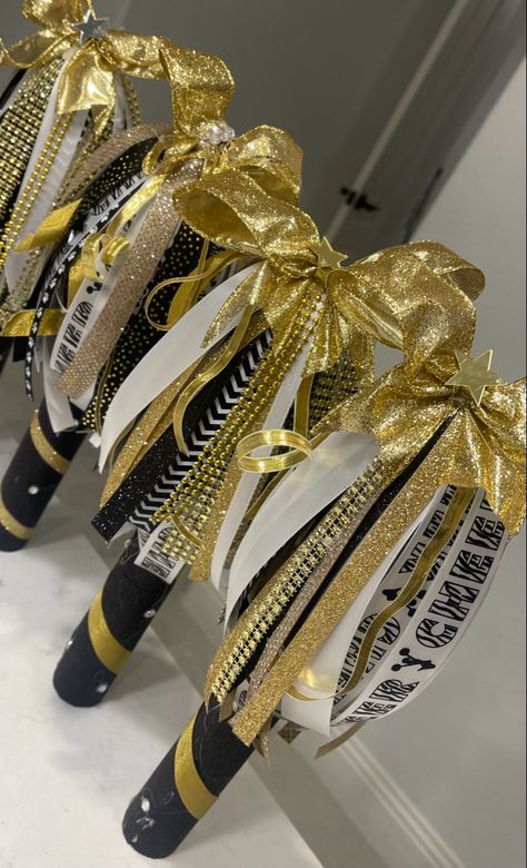 Black and gold cheer spirit sticks Cheer Spirit Stick Ideas, Cheerleader Spirit Sticks, Diy Cheer Spirit Sticks, School Spirit Stick, Spirt Stick Ideas, Spirit Stick Ideas Diy Cheer, How To Make A Spirit Stick Cheer, Cheer Sticks Spirit Diy, Spirit Stick Decorating Ideas