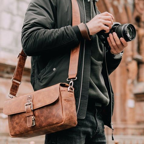 MegaGear Top Grain Italian Leather Handcrafted Camera Messenger Bag for Mirrorless, Instant and DSLR Cameras Product Details: - Top Grain Italian Leather Camera Messenger Bag - Horizontal Carry Style - Lightweight, Compact Travel Size - Heavy-Duty Shockproof Lining - Removable, Adjustable Dslr Camera Bag, Leather Passport Wallet, Leather Camera Strap, Custom Strap, Dslr Cameras, Leather Camera Bag, Camera Bags, Compact Camera, Leather Messenger Bag