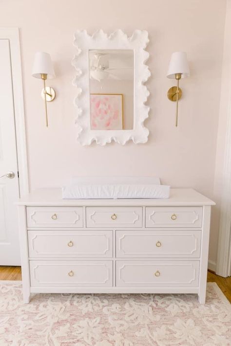 Baby Girl Nursery Pink White And Gold, Off White Nursery Furniture, Mirror Above Crib, Nursery With Sconces, Wall Sconces Nursery, Gold Accent Nursery, Sconces In Nursery, White Walls With White Furniture, Pink And Wood Nursery