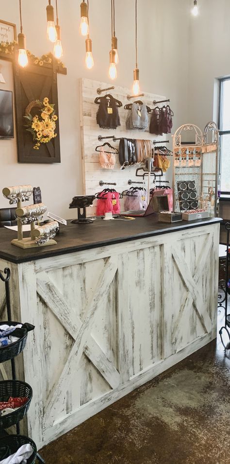 We are loving the transformation of our checkout counter. :) Store Front Design Boutiques, Rustic Storefront Ideas, Diy Store Fixtures, Boutique Counter Ideas Retail, Country Boutique Decor, Western Boutique Interior Design, Cheap Display Ideas, Boutique Staging Display Ideas, Decorating A Boutique