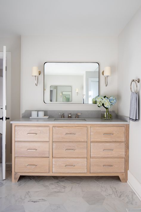 A modern marble bathroom with Grey Quartz Countertop and White Washed Oak Vanity. Take a peek at more details from this project here: https://www.vhinteriors.com/balmoral-ave Wood Vanity With Grey Countertop, Grey White And Wood Bathroom, White Oak Cabinets Grey Countertop, Marble And Oak Bathroom, Grey Countertop Bathroom, Grey Quartz Countertops Bathroom, Bathroom With White Oak Vanity, Bathroom Grey Countertop, Grey Countertops Bathroom