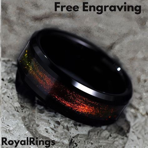 Experience the cosmic beauty of our Galaxy Fire Opal Black Tungsten Ring, a stunning blend of modern elegance and celestial wonder. Designed for both men and women, this 8mm black tungsten ring features an eye-catching inlay of fire opal, mimicking the mesmerizing hues of a distant galaxy. 🔥 Features: ✔ Durable Tungsten Carbide - Scratch-resistant & built to last ✔ Galaxy Fire Opal Inlay - Shimmering blues, purples, and fiery orange tones ✔ Comfort Fit Band - Smooth & comfortable for everyday wear ✔ Unisex Design - Perfect as a wedding ring, promise band, or anniversary gift ✔ Free Custom Engraving - Personalize it with a special message 🎁 Perfect Gift For: Weddings & engagements 💍 Anniversaries & promise rings ❤️ Space & astronomy lovers 🌠 Unique, meaningful gifts 🎁 🔹 Sizing & Packa Space Rings, Promise Band, Astronomy Lover, Black Tungsten Rings, Tungsten Wedding Rings, Black Tungsten, Wolfram, Tungsten Ring, Space And Astronomy