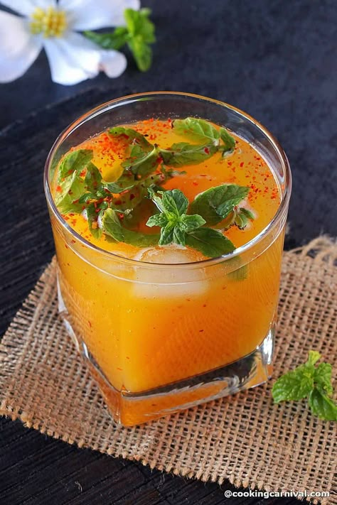 Looking for a refreshing and fruity drink to liven up your festivities? Try the Tamarind Mango Mocktail, inspired by the flavors of the Mexican drink Mangonada. This Cocktail is made with a blend of mango nectar, tamarind pulp, fresh mint, and spices. Its perfect combination of sweet, tart, and mild spice flavors makes it ideal for serving at parties. Add sparkling water or club soda to make it a drink everyone can enjoy at your festive gathering! Mango Mocktail Recipe, Mango Mocktail, Tamarind Drink, Mango Drink, Drinks Refreshing, Mango Cocktail, Indian Drinks, Mexican Drinks, Drink Recipes Nonalcoholic