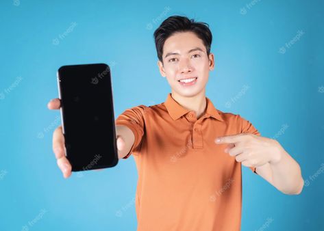 Premium Photo | Photo image of young asian man holding smartphone on blue background Free Casino Slot Games, Asian Boy, Asian Man, Casino Slot Games, Photo Photo, Asian Boys, Slots Games, Asian Men, Android Phone