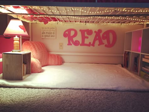 Created a cute little "Reading Nook" under my daughter's loft bed, complete with a curtain to close. Reading Space Under Loft Bed, Loft Bed Reading Nook Ideas, Under Loft Bed Reading Nook For Kids, Reading Nook Loft Bed, Loft Bed Book Nook, Kids Couch Under Loft Bed, Loft Bed Nook Ideas, Reading Corner Under Loft Bed, Loft Bed With Reading Nook Underneath