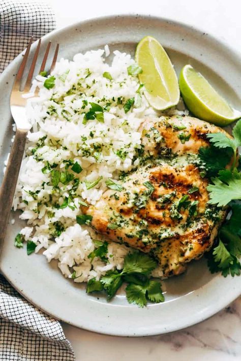 Coconut Lime Grilled Chicken Bowls! Grilled marinated chicken, fluffy rice, and excessive handfuls of mint and cilantro, finished off with a generous drizzling of big and flavorful creamy coconut lime sauce. #chicken #grilling #coconut Ginger Peanut Chicken Pinch Of Yum, Coconut Rice Chicken Recipe, Grilled Chicken And Rice, Lime Grilled Chicken, Pinch Of Yum, Chicken Bowls, Fluffy Rice, Lime Recipes, Sauce Chicken