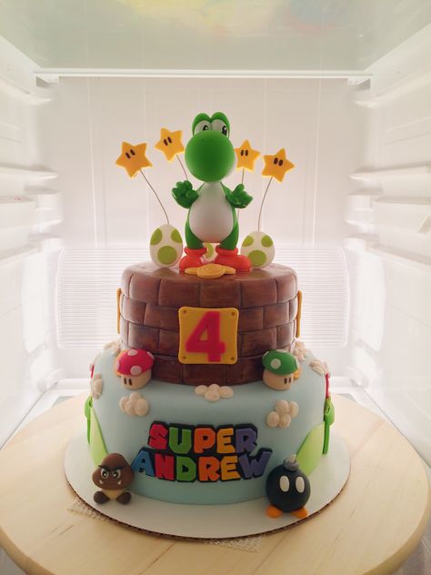 Yoshi / Super Mario theme birthday cake. Yoshi: toy purchased from eBay. All decorations fondant. Mario And Yoshi Cake, Yoshi Birthday Party Cake, Yoshi Themed Birthday, Yoshi Birthday Party Ideas, Super Mario Birthday Party Cake, Mario Themed Birthday Cake, Yoshi Party Ideas, Yoshi Birthday Party, Yoshi Birthday Cake