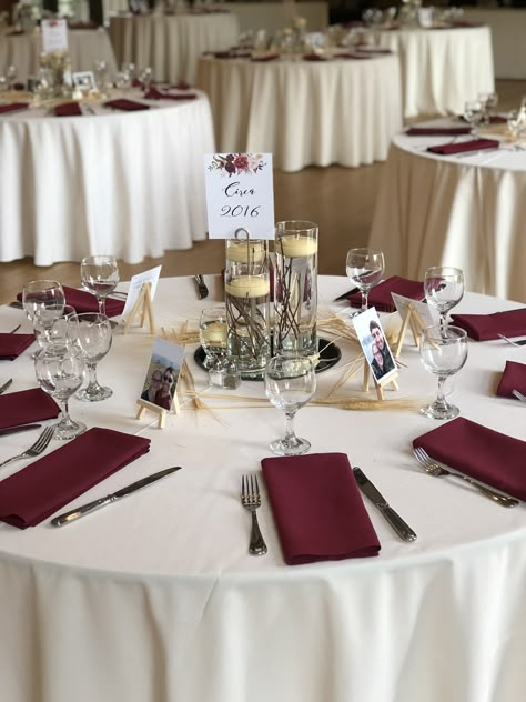 Ivory table linens with burgundy napkins Maroon Napkins Wedding, Burgundy Napkins Wedding, Rose Gold Wedding Table Settings, Maroon Wedding Table Decor, Ivory Table Linens Wedding, Burgundy Wedding Table Setting, Burgundy Silver Wedding, White And Burgundy Wedding, Gold Wedding Reception Tables