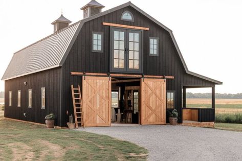 14 Black Barndominium Exterior Ideas for a Bold and Stylish Look - My Decor Inspo Black Fox Exterior, Houses With Black Roofs, Barndominium Colors, Black Barndominium Exterior, Barn Exterior Ideas, Barndominium Exterior Ideas, Unique Barndominium, Blue And Cream Bedroom, Barndominium Exterior