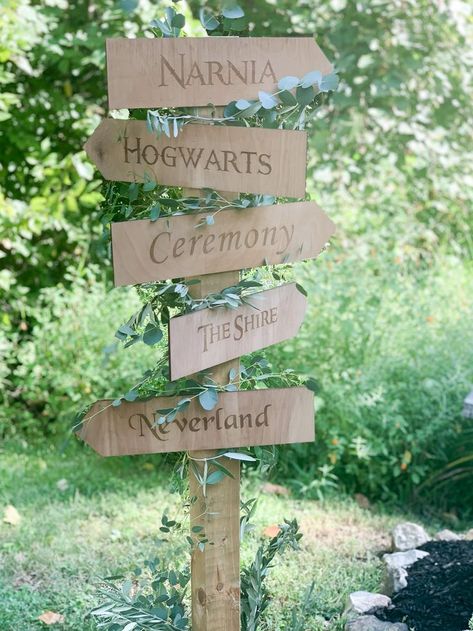 Wood Directional Post Sign with Narnia, Hogwarts, The Shire, and Neverland arrows for private estate fairytale wedding in Indianapolis decorated with greenery, , indiana calligrapher, engraved wedding invitation, carmel wedding invitations, noblesville bridal shop, brownsburg print shop, indianapolis wedding planner, lavender wedding invitation, fine art wedding, fine art wedding, artist wedding, wood wedding details, wood wedding sign, summer estate wedding, Fairytale Wedding Aisle, Fairytale Woodland Wedding, Fairytale Farm Wedding, Diy Fairytale Wedding Decor, The Shire Wedding, Narnia Themed Wedding, Narnia Wedding Theme, Wedding Decorations Fairytale, Fantasy Party Decorations