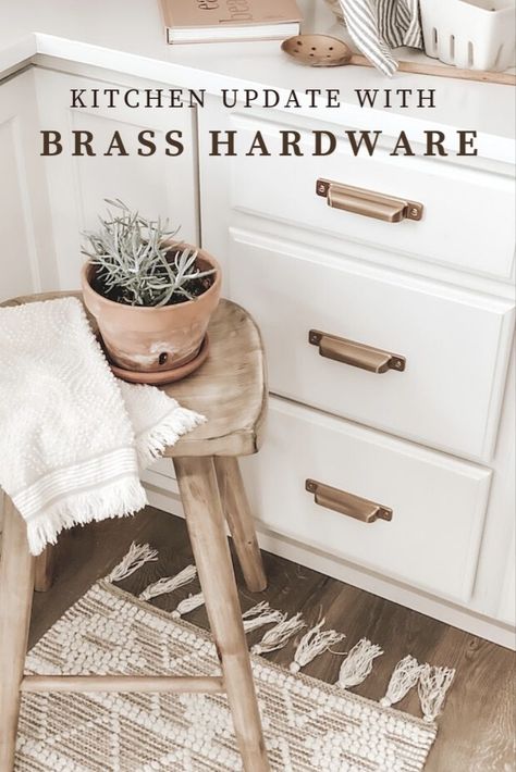 brass hardware. white kitchen cabinets. behr shoelace. spring decor. pergo timbercraft wheaton oak floors. wide plank wood laminate floors. brass drawer pulls. kitchen hardware. Wood Cabinet Pulls On White Cabinets, White And Wood Kitchen Brass Hardware, Wood Cabinet Pulls Kitchen, Antique Brass Kitchen Hardware White Cabinets, Wood Kitchen Hardware, Brass Kitchen Hardware White Cabinets, Behr Shoelace, Kitchen Hardware White Cabinets, Antique Brass Kitchen Hardware