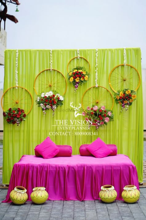 Photo By The Vision Event - Wedding Planners Mahendi Background Decoration, Indian Mehndi Function Decoration, Simple Event Decorations, Mehendi Simple Decoration, Simple Mehandi Decorations, Mehandi Wedding Decoration, Simple Mehandi Backdrop, Mahendi Stage Decoration, Indian Wedding Mehendi Decoration