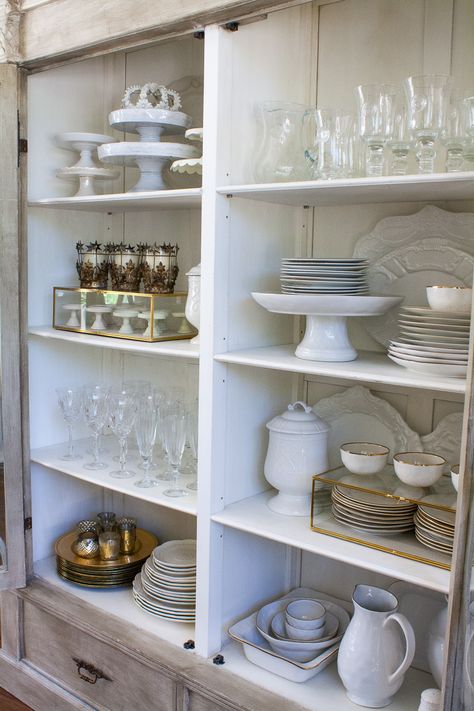 How to style your china cabinet. China Cabinet Essentials  A set of white dishes {dinner plates, salad plates, bowls} Set of glassware {stemware & tumbler} Set of Silverware {gold and / or silver} Napkin Rings Chargers 3-5 Serving Platters Large Pitcher Cake Plates Votives & Candle Sticks White Napkins China Cabinet Set Up, How To Store Serving Platters, How To Style Buffet Cabinet, How To Display Glassware, How To Display Dishes In China Cabinet, How To Display China In Cabinet, China Cabinet Organization, China Cabinet Display Ideas, China Display Ideas