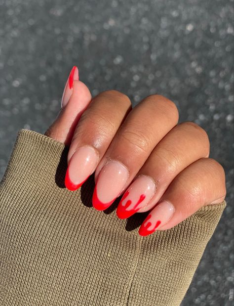 Elevate your Halloween look with these chic oval acrylic nails featuring a spooky twist on the classic French tip. The blood-red drip design adds a haunting touch to a neutral base, perfect for Halloween parties or a subtle nod to the season. Easy to recreate and sure to turn heads, these nails combine elegance with eerie vibes. #HalloweenNails #OvalAcrylics #RedDripNails #SpookyManicure #nailartideas Drip French Tip Nails, Nails Oval Acrylic, French Tip Nails Oval, Blood Drip Nails, Drippy Nails, Classic French Tip, Red Drip, Oval Acrylic Nails, Acrylic Manicure