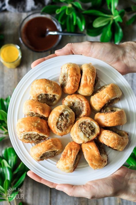 British Sage and Fennel Sausage Rolls: buttery rough puff pastry and a simple pork sausage filling make this traditional British food a delicious appetizer. Serve them warm or cold at a party with HP sauce or mustard—they’ll disappear quickly! | www.savortheflavour.com #sausagerolls #sausage #puffpastry #britishfood #appetizer British Christmas Recipes, British Christmas Food, British Sausage Rolls, Appetizers Puff Pastry, British Sausage, British Picnic, British Snacks, British Food Traditional, Rough Puff