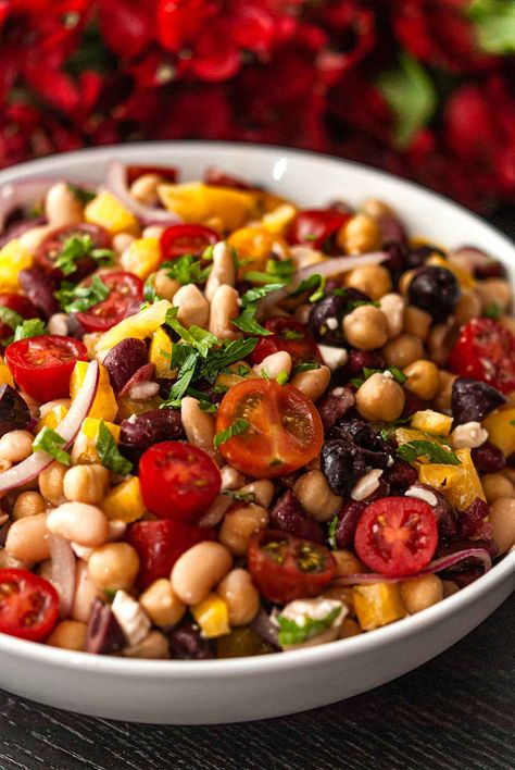 This easy, traditional Italian bean salad recipe includes garbanzo beans, canellini beans, and kidney beans with a few more tasty surprises! Tomatoes, bell pepper, sweet onion, feta, kalamata olives and fresh parsley make this beautiful summer salad even more delicious and impressive! It also takes less than 30 minutes to make! Lupini Bean Salad, Italian Bean Salad, Everyday Salads, Bell Pepper Side Dish, Bean Salad Recipes Healthy, Canellini Beans, Fancy Picnic, Salad Supreme, Vegan Bean Salad