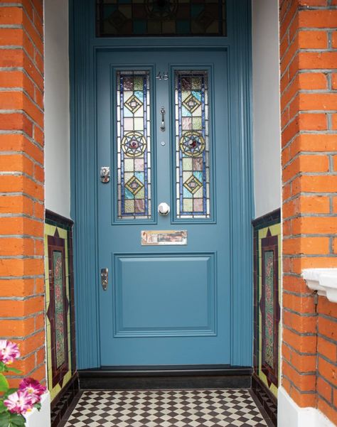 This luxury blue Victorian door painted in our unique colour, Cornflower features stunning stained-glass panels and traditional Victorian design elements. Blue Stained Glass Front Door, Tiffany Blue Door, Stained Glass Victorian Front Door, Stained Glass Door Victorian, Blue Front Door Red Brick House, Stainglass Front Doors, Front Door With Glass Design, Victorian House Front Door, Terraced House Front Door