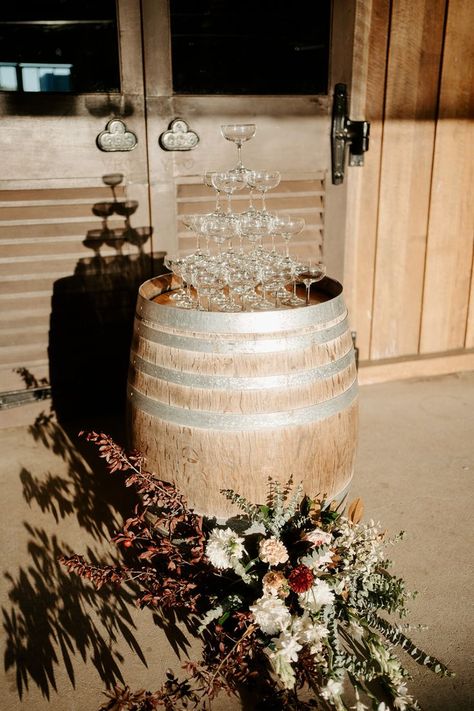 A stunning champagne tower awaits Jacqueline and Warick at their Yabbaloumba Retreat wedding reception. Set atop a rustic barrel, the glasses are ready for a cascade of champagne, with a beautiful floral arrangement adding a touch of rustic elegance to the scene. This picturesque setup captures the essence of a romantic, rustic country wedding. Plan your unforgettable wedding reception at Yabbaloumba Retreat and create memories that will last a lifetime. Country Glam Wedding, Wine Barrel Wedding, Rustic Glam Wedding, Dream Wedding Reception, Holiday Bar, Elegant Wedding Reception, Wedding Display, Champagne Tower, Country Weddings