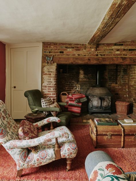 An 18th-century farmhouse brimming with colour and texture | House & Garden 1700 Cottage Interior, 18th Century Cottage Interior, English Farmhouse Interiors, English Country Cottage Interiors, 18th Century Cottage, British Cottage Interior, Fireplace Chair, Cottages Interiors, Hearth Fireplace