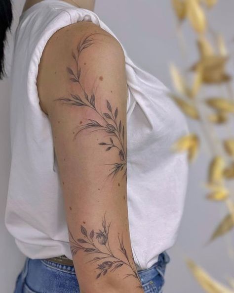 Season Tattoo Sleeve, Poppy Arm Wrap Tattoo, Leafy Half Sleeve Tattoo, Airy Tattoos For Women, Dainty Floral Arm Wrap Tattoo, Shoulder Vine Tattoo Stencil, Greenery Shoulder Tattoo, Flower Tattoos Around Arm, Coverup Tattoo Ideas Ribs