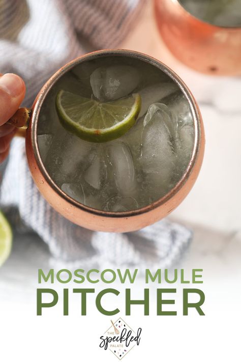 Make a Moscow Mule Pitcher for your next gathering! This light, citrusy pitcher drink is easy to make and simple to serve to a crowd! #easyentertaining #happyhour #speckledpalate Holiday Moscow Mule Pitcher, Moscow Mule Pitcher Recipe, Holiday Moscow Mule, Pitcher Drink Recipes, Moscow Mule Drink, Pitcher Drinks, Pitcher Cocktails, Moscow Mule Recipe, Vodka Lime