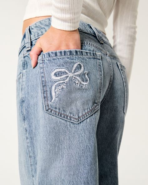 Women's Low-Rise Medium Wash Embroidered Bow Baggy Jeans | Women's New Arrivals | HollisterCo.com Bow Jeans, Embroidered Bow, Fall Fit, Women's Bottoms, Comfortable Jeans, Hollister Jeans, Low Rise Jeans, Designer Jeans, Washed Jeans