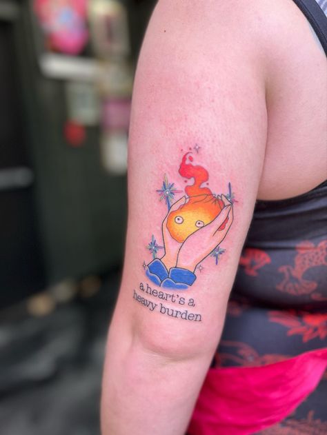 Sophie Holding Calcifer Tattoo, Howell Moving Castle Tattoo, Small Castle Tattoo, Howls Moving Castle Tattoo Calcifer, Howl Pendragon Tattoo, Studio Ghibli Tattoo Ideas Howl's Moving Castle, Calcifer Tattoo, Howls Moving Castle Tattoo, Howl's Moving Castle Tattoo