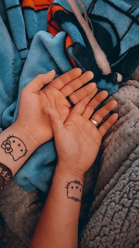 Hello Kitty And Daniel Tattoo, Matching Hello Kitty Tattoos Couple, Gf And Bf Tattoos, Matching Tattoos For Gfs, Couple Tattoos Cartoon, Matching Bf And Gf Tattoos, Y2k Couple Tattoos, Hello Kitty Couple Tattoo, Hello Kitty And Dear Daniel Tattoo