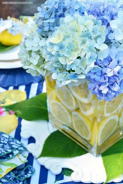 When life or a trip to the grocery store gives you lemons, make an easy table centerpiece, no floral arranging skills required! I'm always looking for an easy table centerpiece and this bag of $4.99 lemons at the grocery store provided some sunny and affordable table inspiration. I used my favorite ‘vase within a vase’ method for flower arranging and a centerpiece for the table. Start with two vases, a smaller one to nest inside a larger one. They can be any shape or size, as long… Lemon Vase, Lemon Centerpieces, Easy Table, Backyard Bbq Party, Endless Summer Hydrangea, Summer Tablescapes, Lemon Decor, Summer Tables, Simple Table