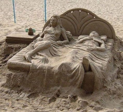 Man & woman lying in a bed  made out of sand art Castle Bed, Art Plage, Sand Sculpture, Sand Castles, Ice Art, Snow Sculptures, Snow Art, Castle Art, Sand Sculptures