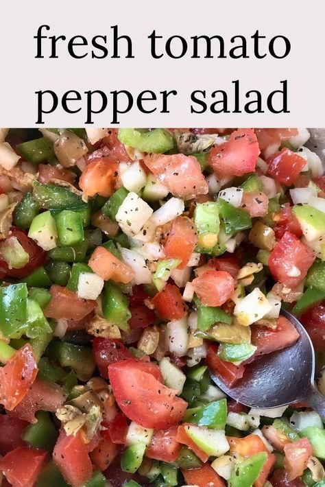 A close up photo of a salad packed with fresh packed chopped tomatoes, onions, olives and green peppers with a spoon in it. Tomato And Peppers Recipes, Onion And Green Pepper Recipes, Bell Pepper And Tomato Recipes, Tomato Green Pepper Onion Salad, Tomatoes Peppers And Onions, Fresh Peppers Recipes, Pepper And Tomato Salad, Uses For Green Peppers, Tomato Pepper Salad