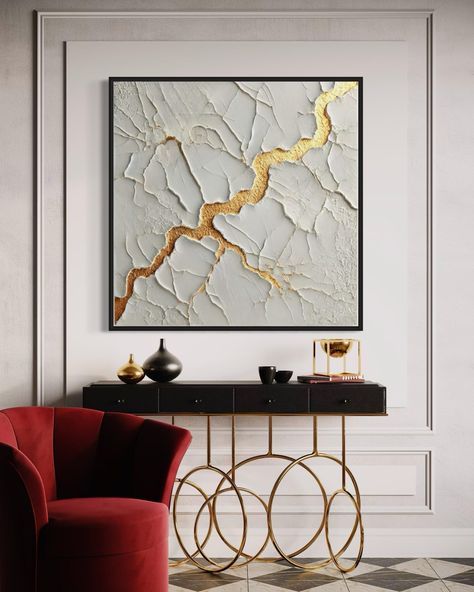 This captivating textured abstract artwork showcases an elegant blend of neutral tones with a striking gold accent running through the center. The rough, cracked surface texture adds depth and dimension, giving the impression of natural stone or an ancient wall, while the gold detail resembles a shimmering vein, reminiscent of the Japanese art of Kintsugi, symbolizing beauty in imperfection. The minimalist color palette allows the rich texture and metallic accent to stand out, making this piece a perfect statement for a modern, sophisticated interior. Its luxurious yet understated design adds both warmth and elegance to any space. ■ COLORS: White,  and Gold  If you would like different colours please send me message. ■ MEDIUM: Professional grade acrylic paints and mediums. Finished with a Womens Painting, Minimalist Color Palette, Metallic Painting, Bedroom Decor Art, Gold Artwork, Beauty In Imperfection, Sophisticated Interior, Minimalistic Art, Painting Bedroom